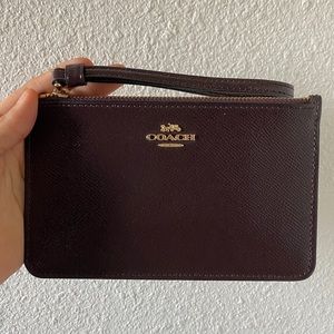 Coach dark burgundy wristlet